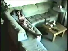 Cute wife masturbates on a couch having no idea about a hidden camera